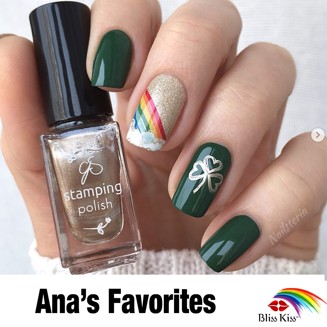 Ana's Favorites
The image shows a photo of artistically painted nails. Themed saint Patricks day. a deep green is the base color. on the ring finger in gold is a three leaf clover and on the index finger is gold glitter and an image of a rainbow. The nails look healthy and beautifully manicured.
The hand is holding a bottle of golden nail polish "stamping polish".