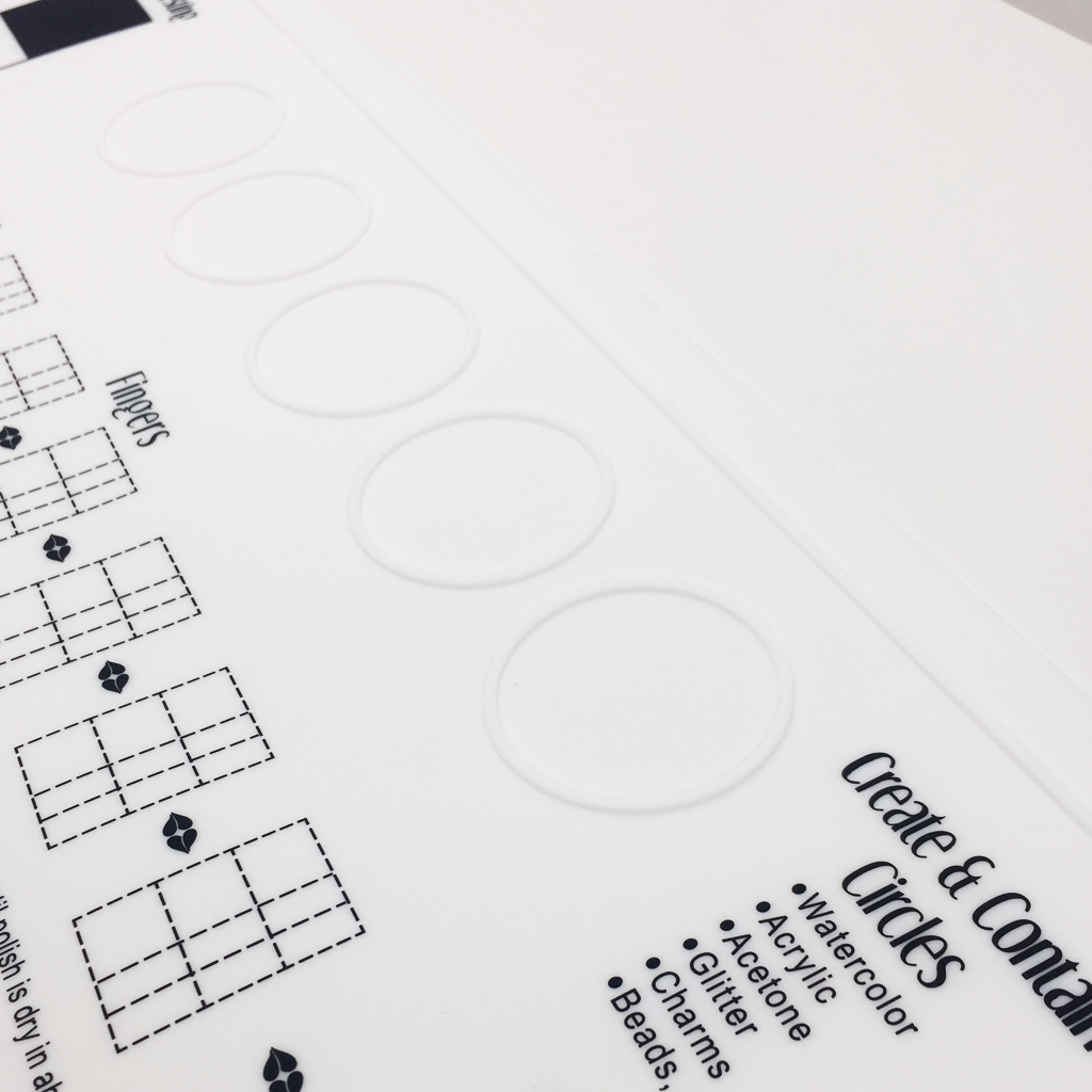 The Simply Neat™ Manicure Mat has a unique raised edge Create & Contain
Circles that help you prevent spills and keeps your creativity neatly contained to the mat... and not all over your workspace.