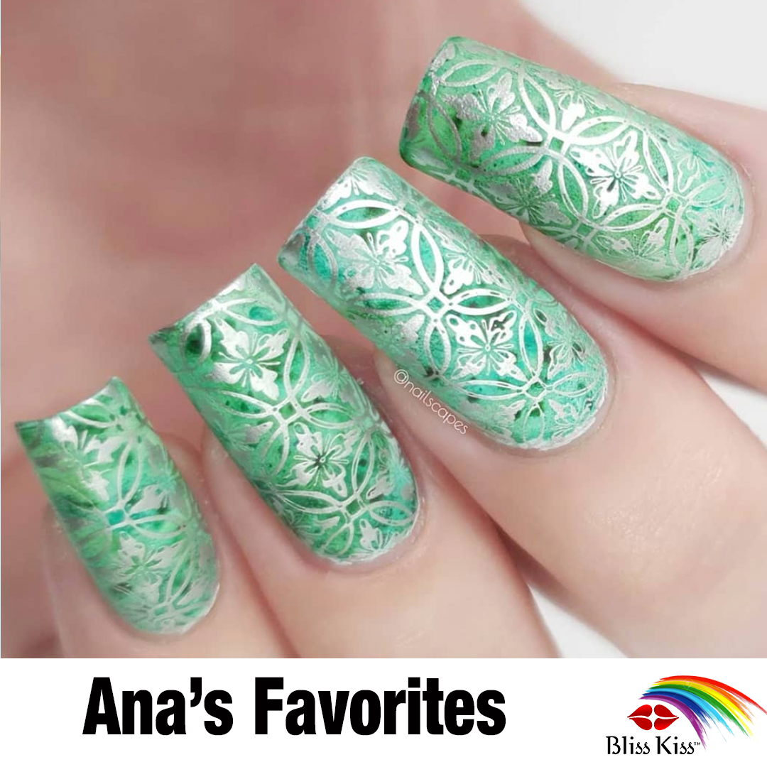 Ana's favorites
image shows a set of nails that are painted a jade green. overlaid is an intricate pattern design that has a mandala / repetitive design. the overlay is an elegant and shiny metallic silver.
The nails and hands are well manicured and hydrated.