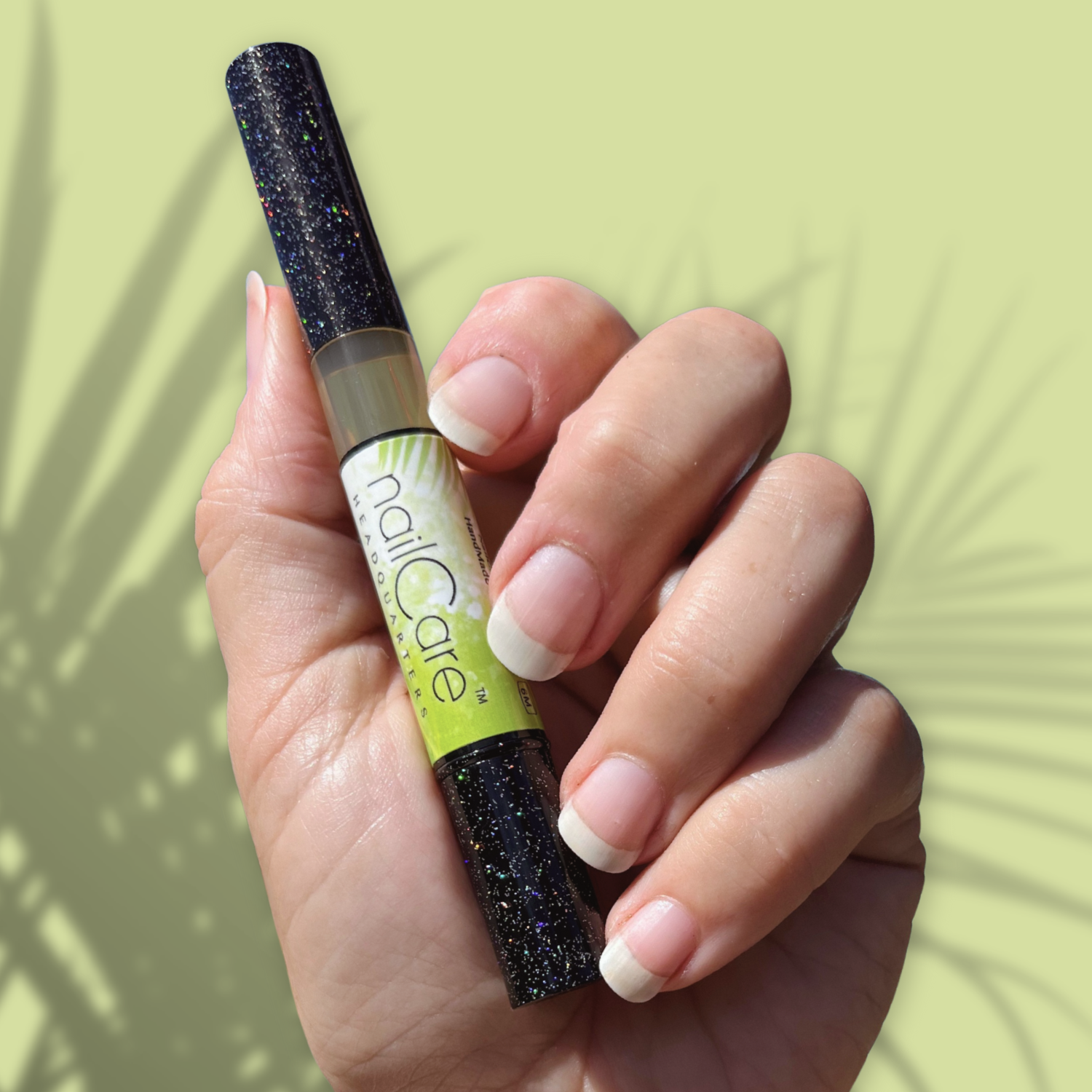 Image shows a well manicured hand holding a Bliss Kiss nail pen with a black holographic design for the cap. 
Nail care headquarters
Simply Pure nail and cuticle oil
Coconut Lime Verbena scent