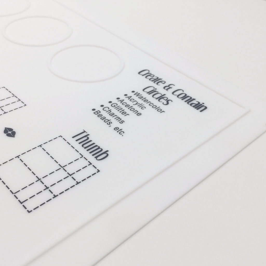 The Simply Neat™ Manicure Mat has a unique raised edge that helps you prevent spills and keeps your creativity neatly contained to the mat... and not all over your workspace.